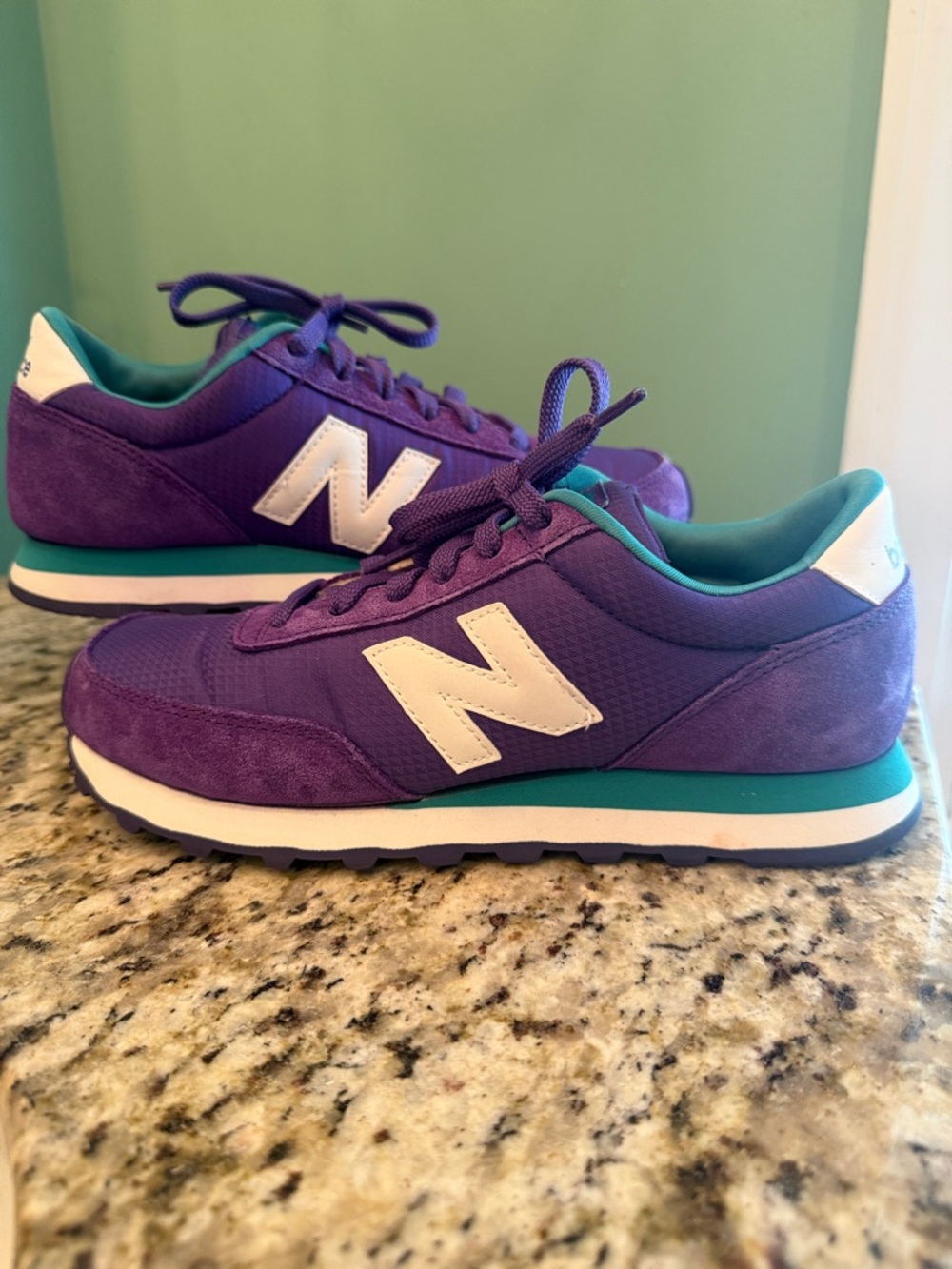 New Balance Women's 501 sneakers in purple and teal colorway